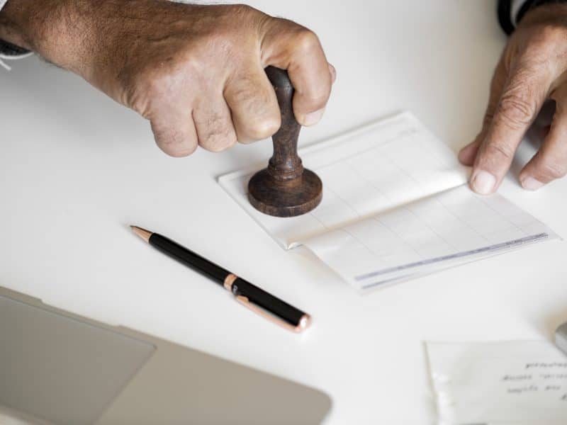 People checking bankbook isolated on white table